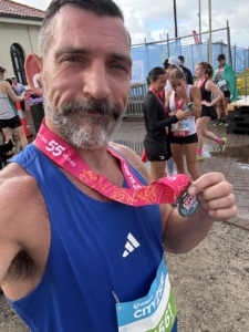Christian from The Body Project finishing the City2Surf in 1:16:21 despite rainy conditions