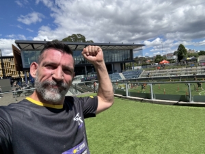 Step out for Cancer - Randwick Race course Sydney Christian Paesano from The Body Project smiling after finishing the Step Out for Cancer Run, celebrating achievement and community support for cancer awareness.