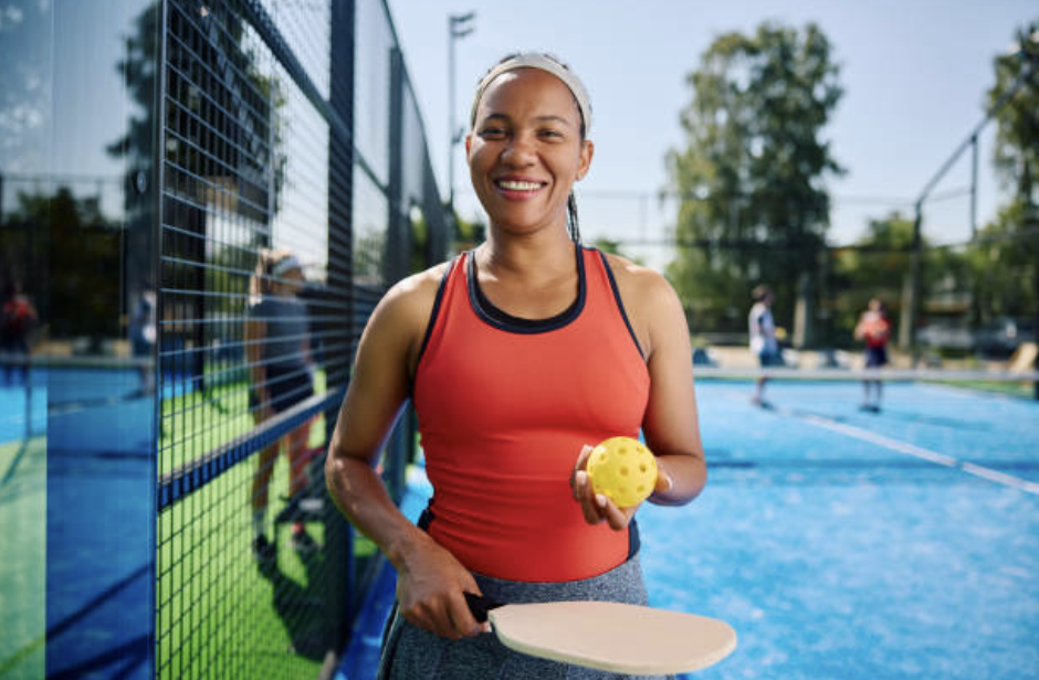 Active Pickleball player on court representing racquet sports performance, injury prevention, and healthy movement through osteopathy.
