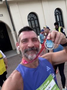 christian-paesano-city2surf-2026-sydney Christian Paesano from The Body Project after completing Sydney City2Surf 2026 in a personal best time of 71:40